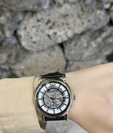 Armani's designers are truly amazing! The skeletonized silver dial paired with t - Click Image to Close