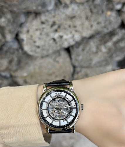 Armani's designers are truly amazing! The skeletonized silver dial paired with t