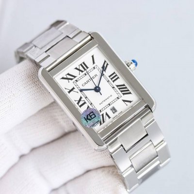 White case, gold band, diamonds, plus 50, steel band, plus another 50. Tw Facto