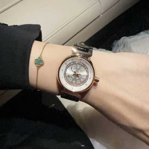 Louis Vuitton, sapphire crystal, Swiss-made movement. The Monogram flower on the