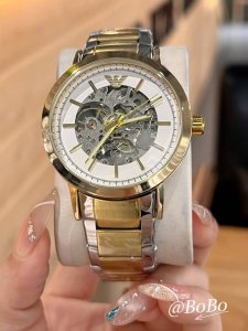 Armani's classic retro skeleton design with three hands exudes elegance and soph