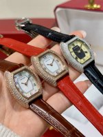 Cartier Mini Lady tonneau-shaped watch, featuring an original Swiss quartz movem