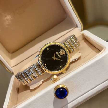 This elegant gold timepiece features a guilloch - Click Image to Close