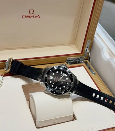 Omega's black ceramic bezel paired with a wave-patterned dial exudes sophistica