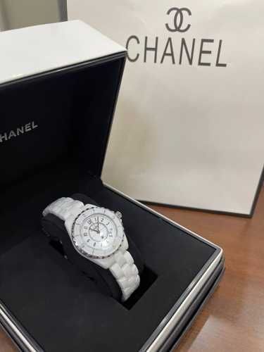 White digital hour markers with a calendar, Chanel J12 series, imported Swiss m