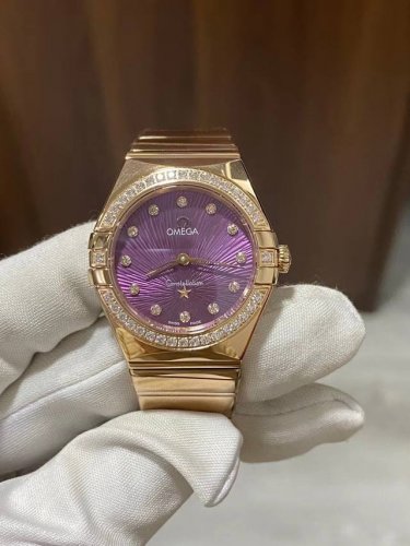 Latest model Omega Women's Constellation 28mm Quartz watch with a full rose gold