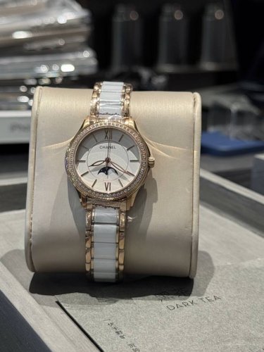 A new Chanel watch with elegant white and gold diamonds, featuring a uniquely c