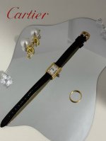 This **Cartier Mini Tank Louis Cartier** is a refined microcosm of the classic