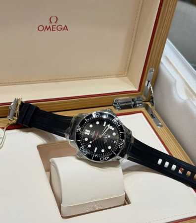 Omega's black ceramic bezel paired with a wave-patterned dial exudes sophistica - Click Image to Close