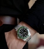 I've been wearing this green Submariner for almost a month now, so let me talk