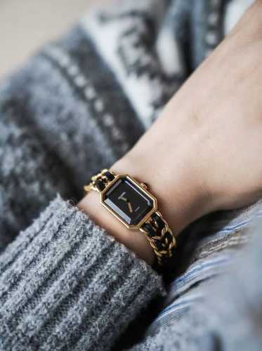 Chanel's sugar cube watch is so perfect for her! The black and gold color schem