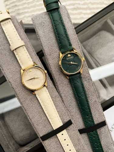 Gucci G-Timeless series, featuring an exquisite embossed leather strap and dial.
