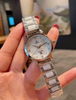 White Gold and Black Omega Fashionable Women's Quartz Watch. A watch that exude