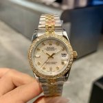 Rolex Datejust 31mm watch with a three-color dial, a wrist art piece where diamo