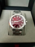 Oris's new 43.5mm Aquis series cherry red calendar watch features a cherry red