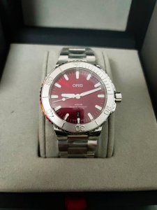 Oris's new 43.5mm Aquis series cherry red calendar watch features a cherry red