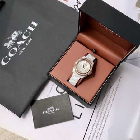 Coach's Ceramic Collection has a new addition! This 32mm diameter quartz watch f - Click Image to Close