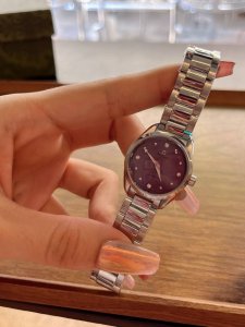The OMEGA Seamaster Aqua Terra ladies' watch, ringed with dazzling diamonds, em