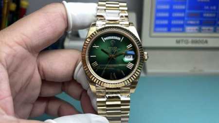 Rolex Day-of-the-Day watch with Roman numerals and smoky green finish. - Click Image to Close