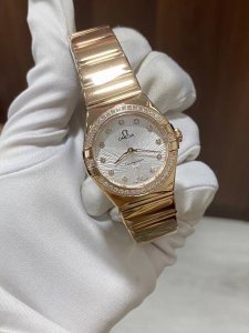 Latest model Omega Constellation 28mm quartz watch with a full rose gold case an