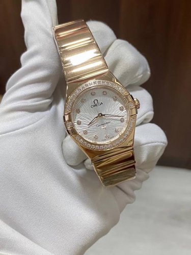 Latest model Omega Constellation 28mm quartz watch with a full rose gold case an