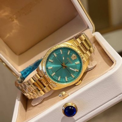 Gold Versace Millenyium Lady watch, featuring the brand's iconic Medusa and Ver