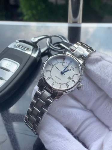 Brand: Plange - Elegant Ladies' Watch, featuring a simple three-hand design with