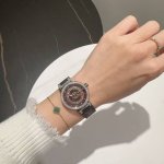 Louis Vuitton, sapphire crystal, Swiss movement. The Monogram flower on the dial