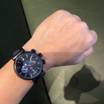 Lv Lv Louis Vuitton Features: A rainbow appears below the logo, with three color