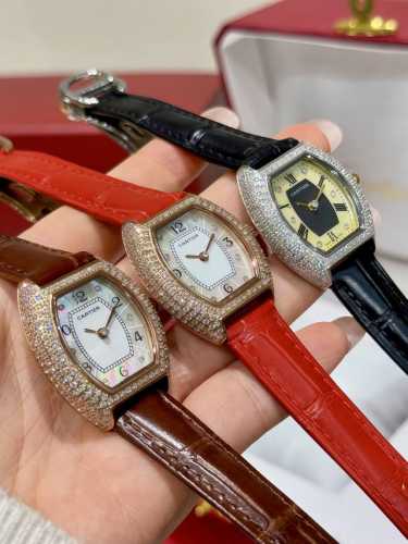 Cartier Mini Lady tonneau-shaped watch, featuring an original Swiss quartz movem